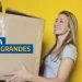 Mulher segurando caixa grande com texto "Frete para produtos grandes"